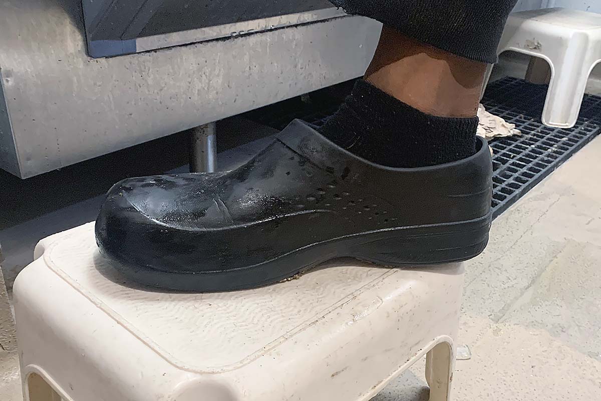 Black Clogs being worn by chef in the kitchen